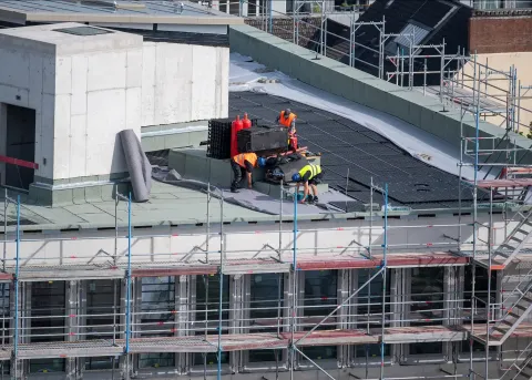 Commercial roofing company on roof